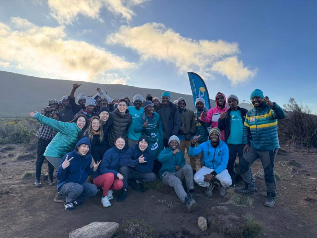 Group of hikers atop Mt. Kilimanjaro
