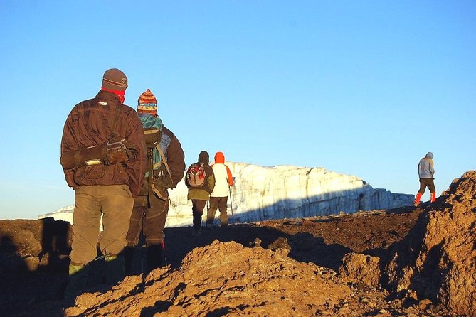 Climbers hiking toward the glacier summit of Mt. Kilimanjaro.